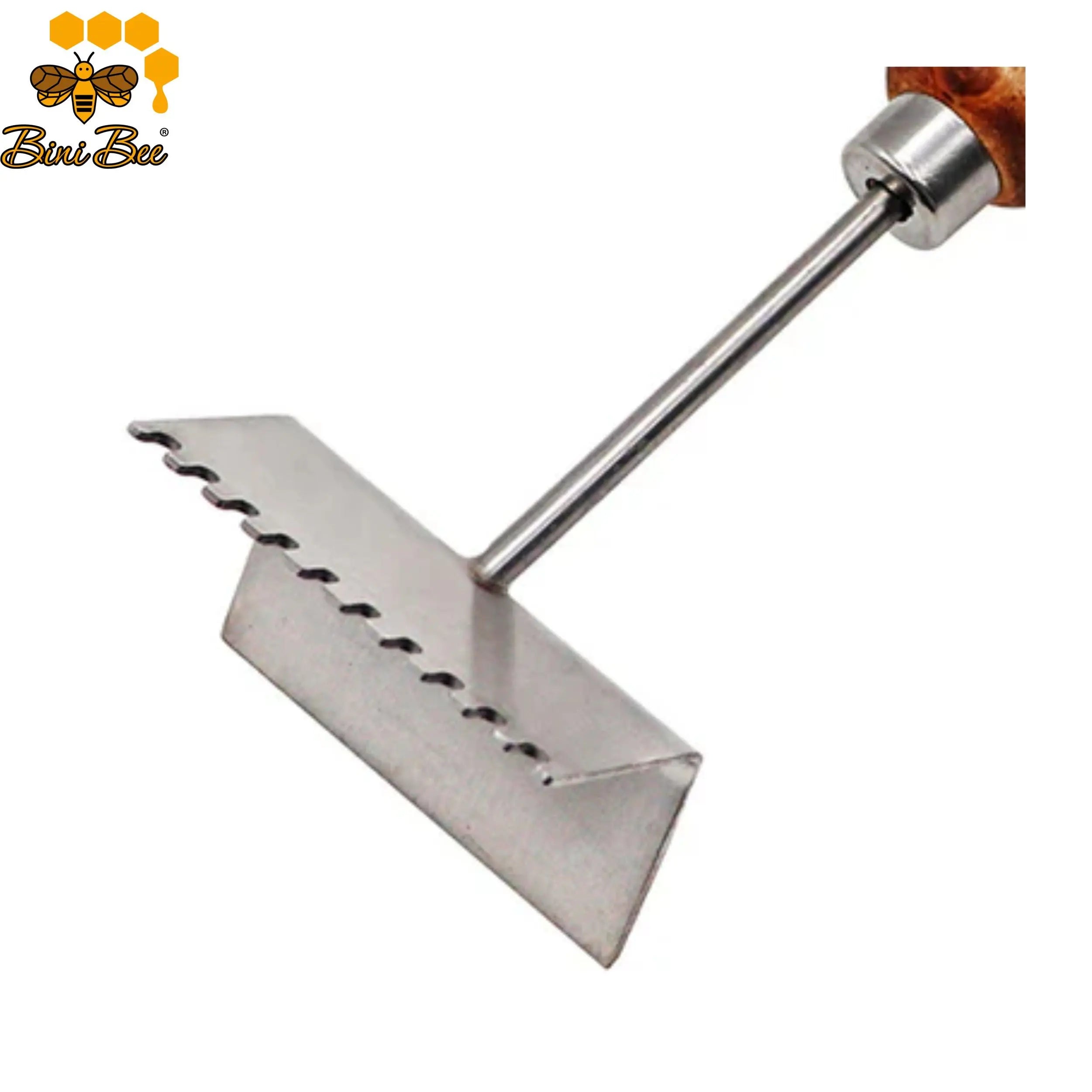 Close-up of a stainless steel queen excluder cleaner tool with a wooden handle, showing the notched teeth cleaning wax from a metal beehive grid.