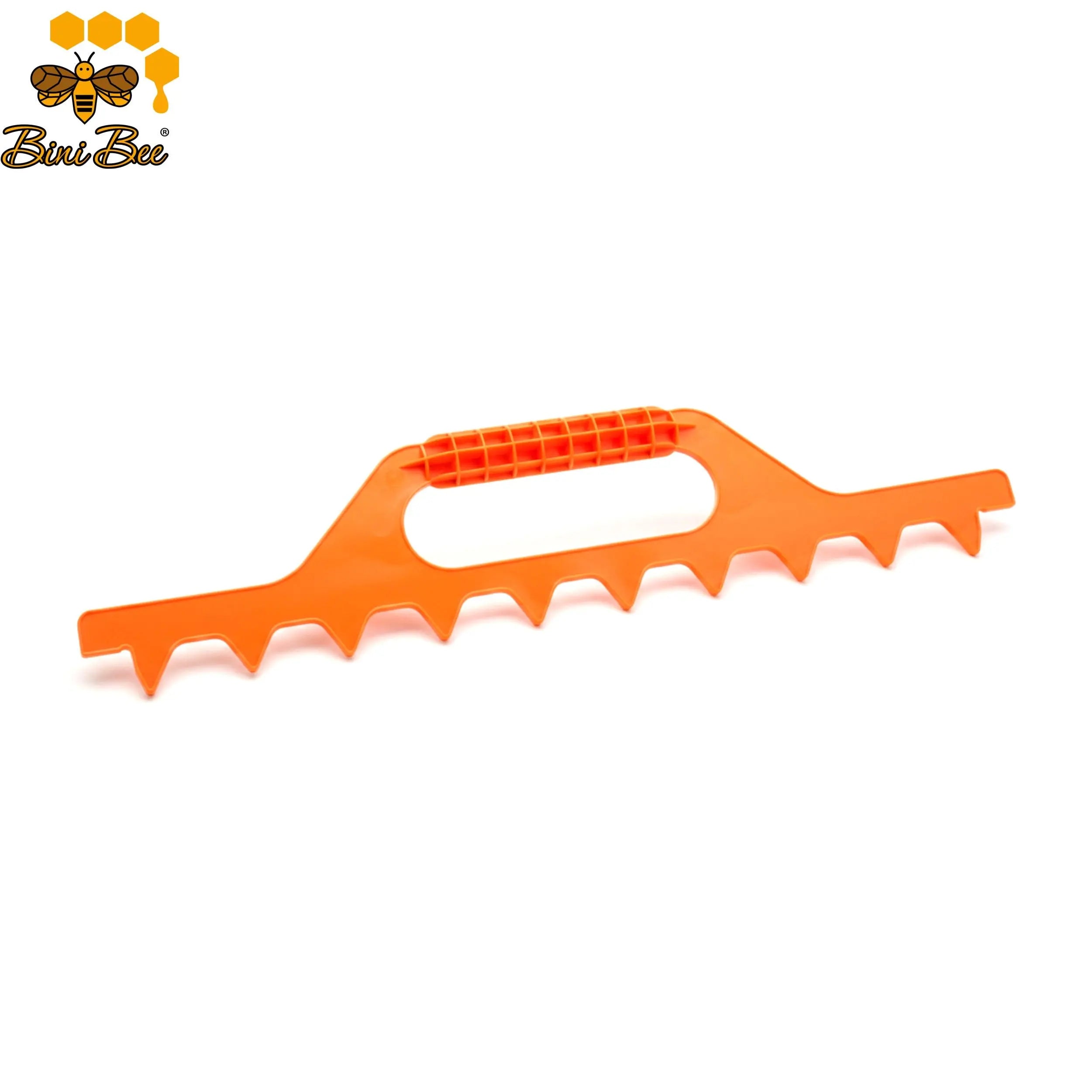 Beekeeper using plastic frame spacer tool to align frames in a 10-frame Langstroth hive