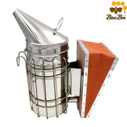 Calm your bees with our Stainless Steel Manual Bee Smoker. Features a protective heat shield, easy-pump bellows, and superior airflow. Shop the essential hive tool!