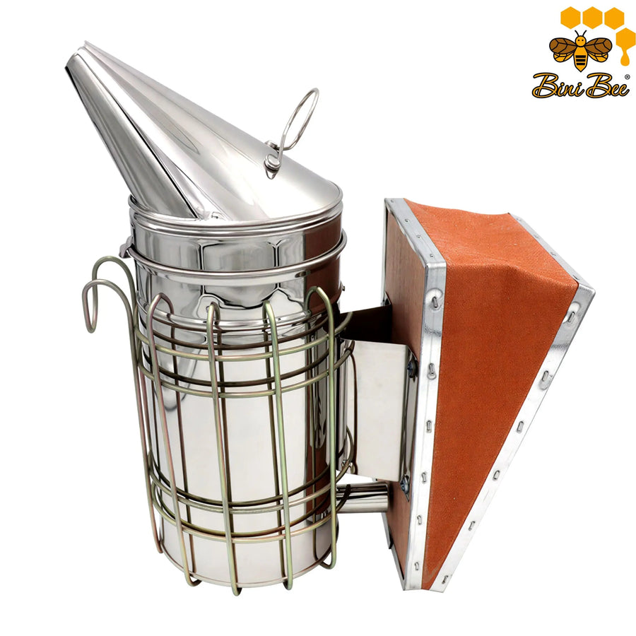 Calm your bees with our Stainless Steel Manual Bee Smoker. Features a protective heat shield, easy-pump bellows, and superior airflow. Shop the essential hive tool!